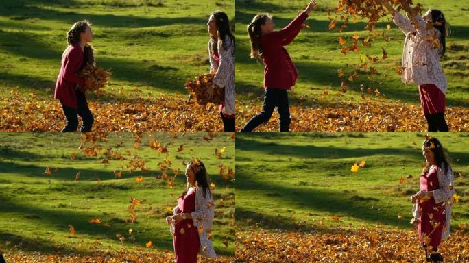 年轻美丽的母亲和她的小女儿在秋天的森林里玩得开心。他们跳起来，把树叶扔向空中。他们在笑。家庭幸福。慢