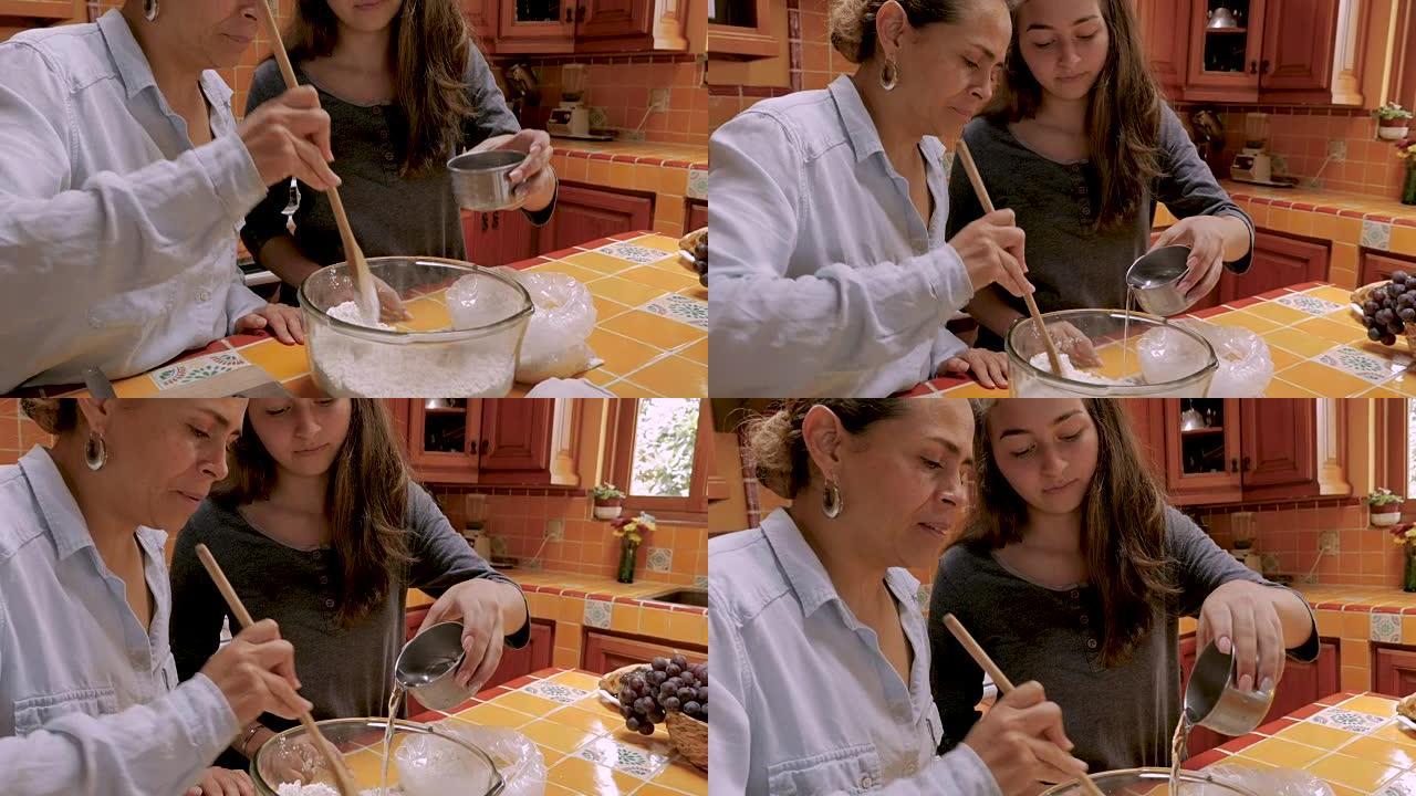 年轻的拉丁裔少女与母亲一起向面粉中加水