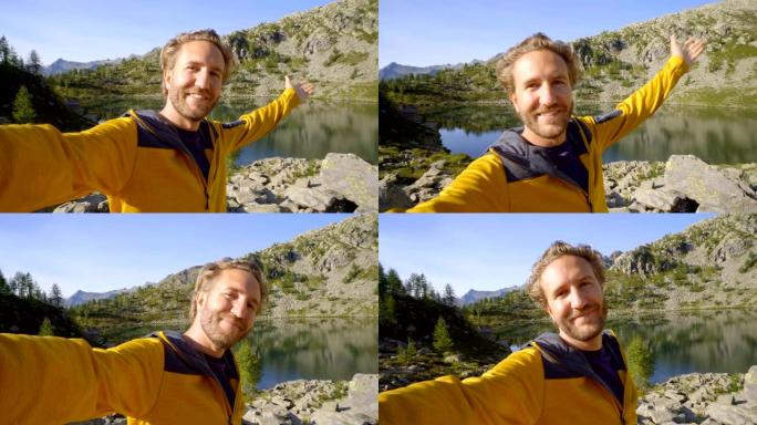 年轻人在山湖自拍。在瑞士徒步旅行的人会自拍，周围是迷人的山景。自拍旅行冒险生活方式
