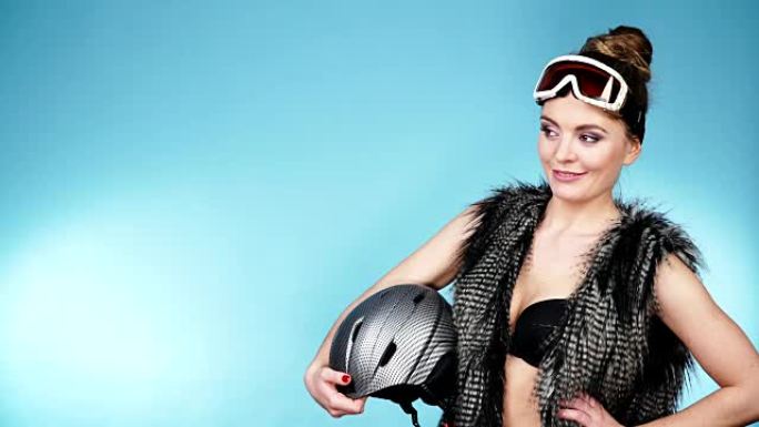 戴滑雪镜的女人戴着头盔。冬季运动4K