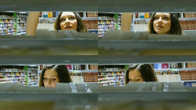 美少女在书店选书镜头在书架中移动