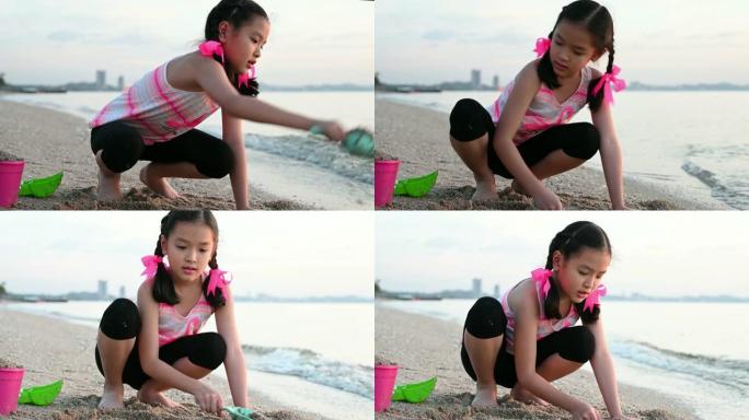 小女孩在沙滩上玩沙子