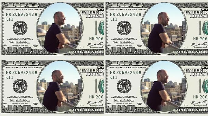男子站在阳台上的框架100美元钞票