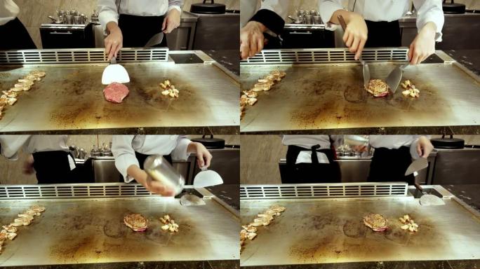 日本厨师在hibachi上准备牛肉铁板烧