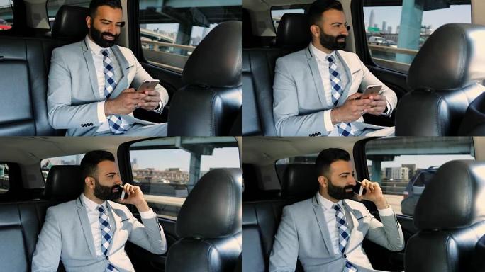 在豪华轿车中使用智能手机的商人