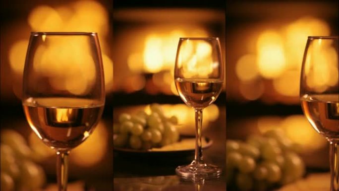 壁炉背景上一个白葡萄酒的垂直视频。