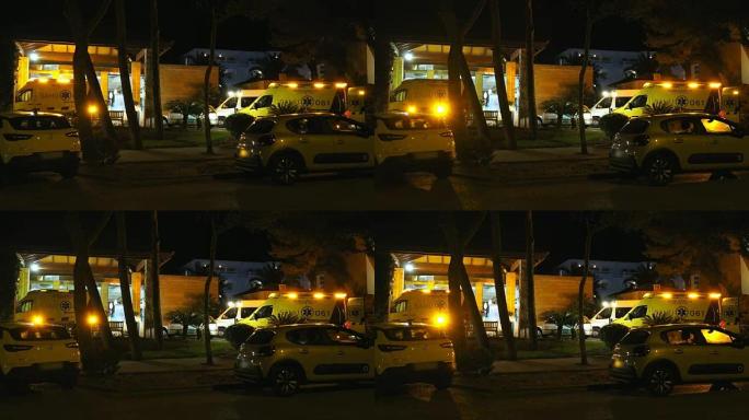 急救室停放有警笛灯闪烁的救护车