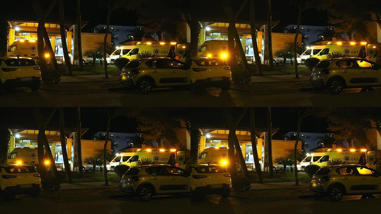 急救室停放有警笛灯闪烁的救护车