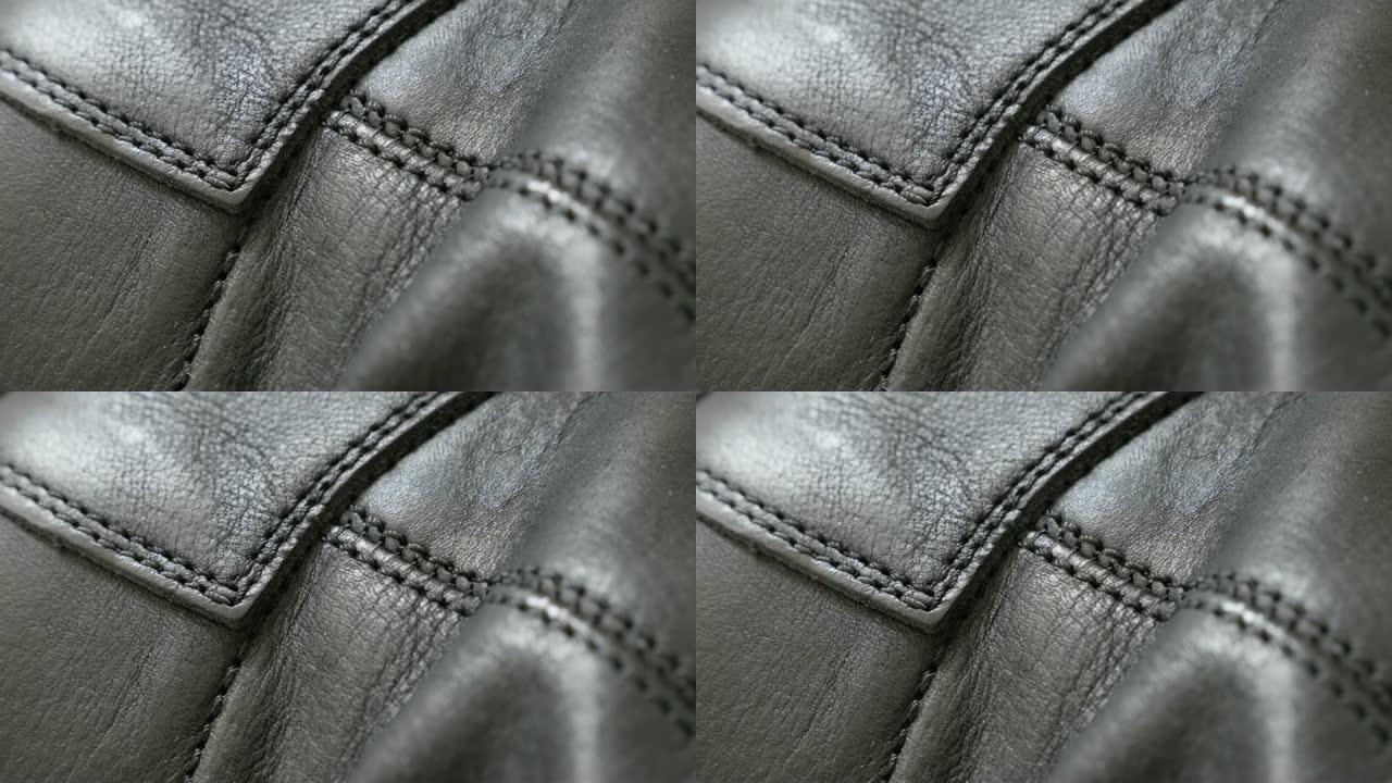 现代女鞋的缝线和细节由真皮4K 2160p 30fps UHD倾斜视频-在粗糙和闪亮的天然皮革织物上