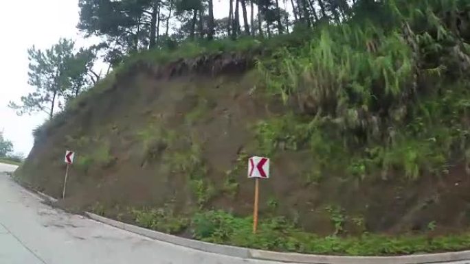 多山的科迪勒拉悬崖边的狭长混凝土铺路。