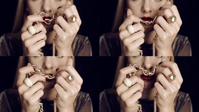 奢华的女孩和黄金珠宝。钻石戒指。