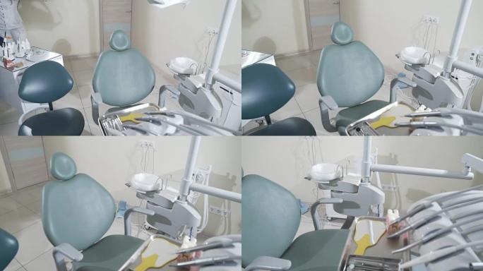 慢动作拍摄医疗牙科办公室配备了牙科治疗和患者入院的专用设备。电机、推车、牙科椅
