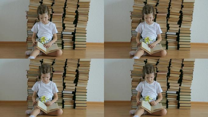 小女孩在地板上寻呼一本书