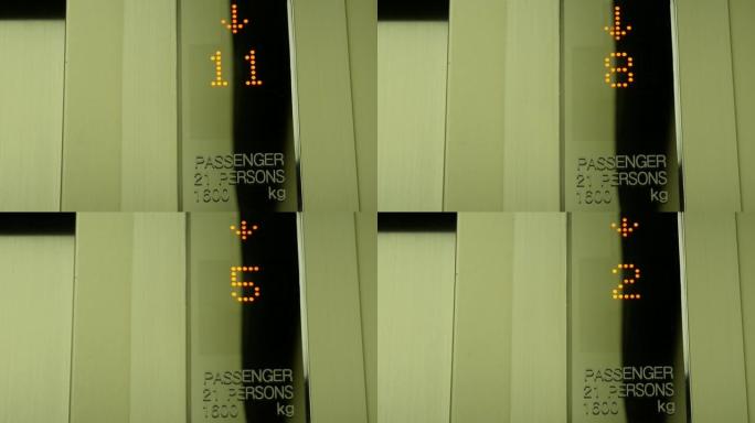 数字显示屏显示电梯内的楼层编号从12层下降到0层。