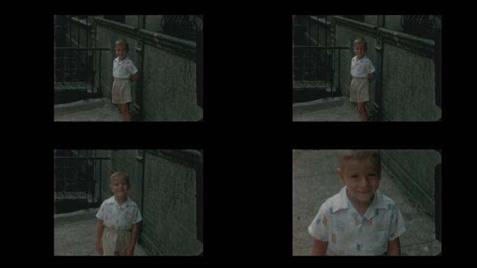 1957可爱的小男孩在纽约市街上对着镜头玩