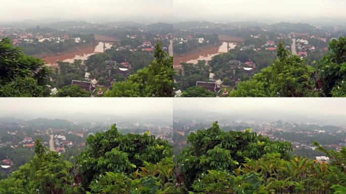 在老挝琅勃拉邦的南汗河上，有雾的早晨，从左到右的广角平移
