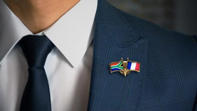 商人带着朋友国家的国旗走向相机，销南非-法国