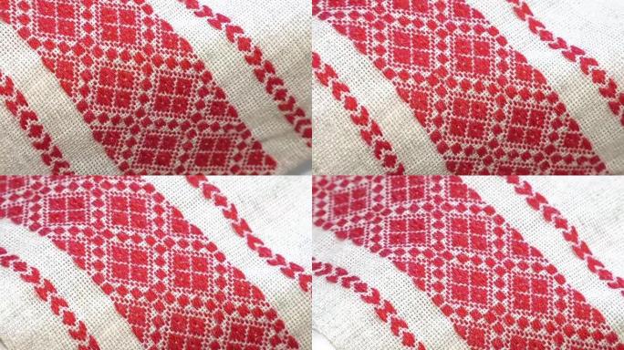 民族红白刺绣。装饰毛巾装饰的过程绣花红色装饰品。