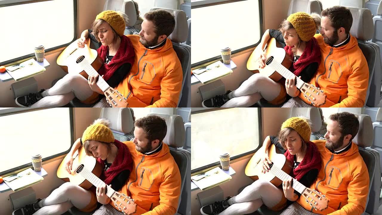 夫妇乘火车旅行并弹吉他
