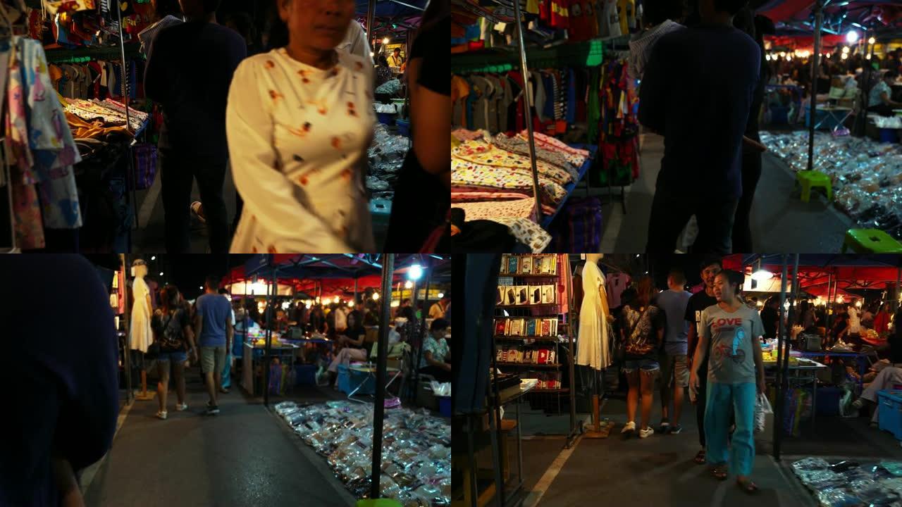 夜市夜景不明的人拉卡人和游客。人们购买拉卡食物和商品。