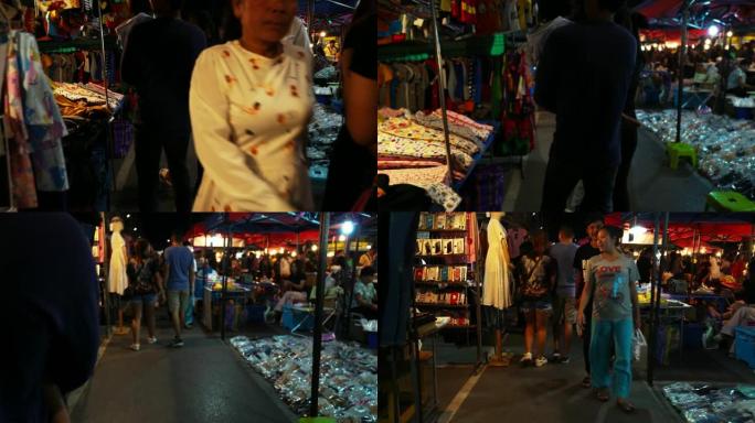 夜市夜景不明的人拉卡人和游客。人们购买拉卡食物和商品。