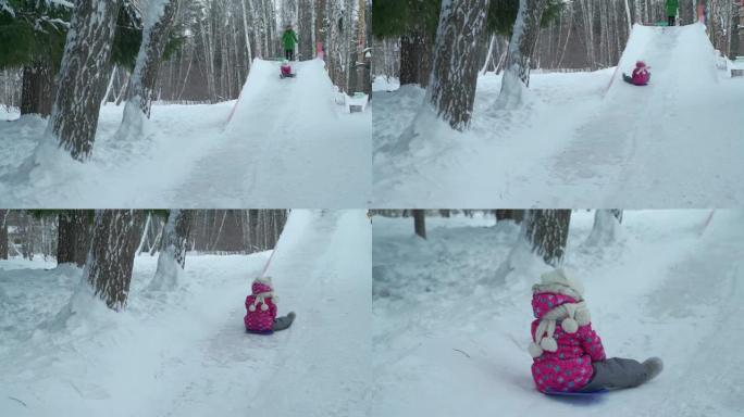小女孩在冬天从冰滑梯上骑行
