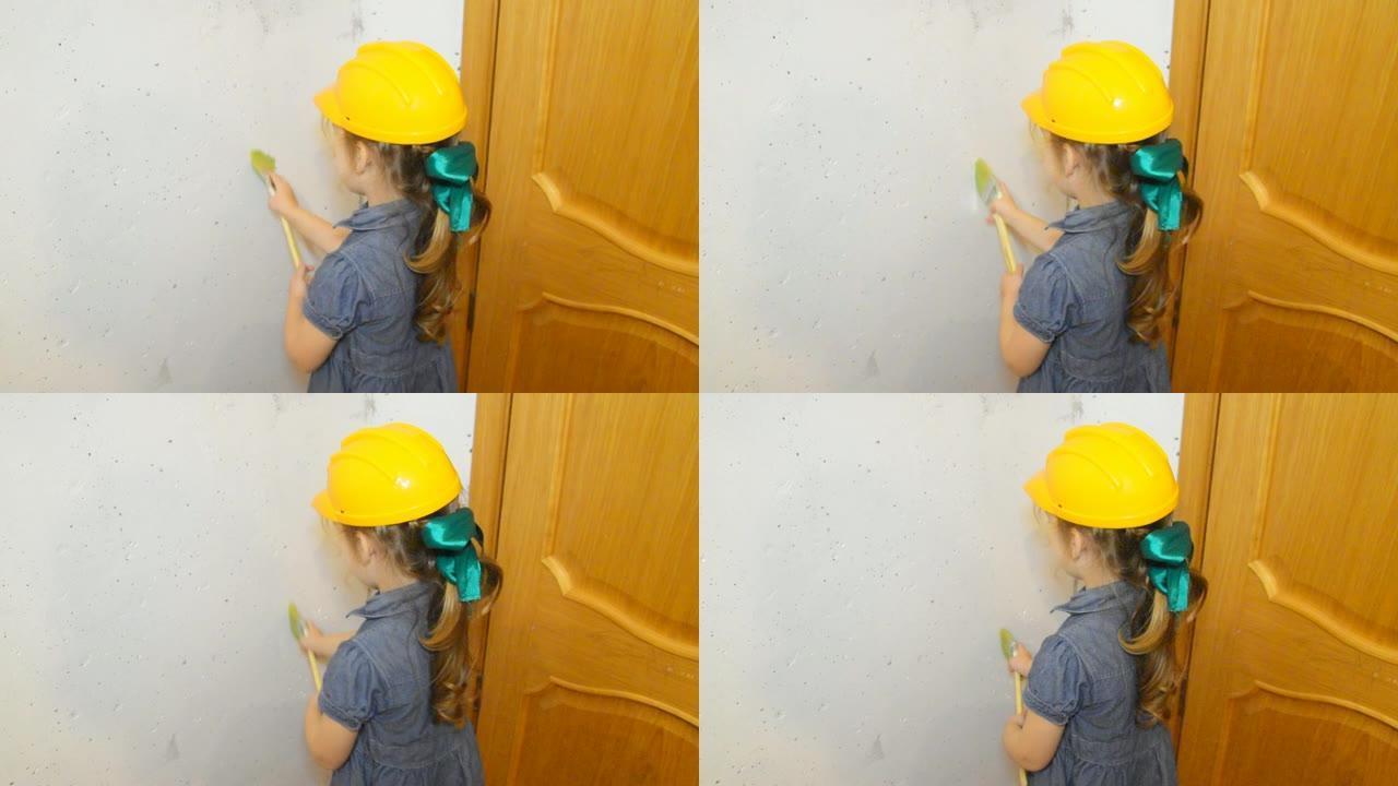 女孩，一个戴着头盔的孩子，刷刷白墙