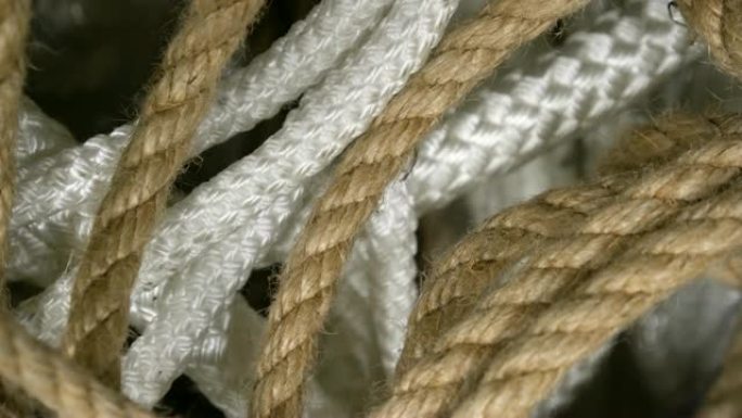 旋转设置绳的棕色，白色形式的螺旋特写。绳索背景设计