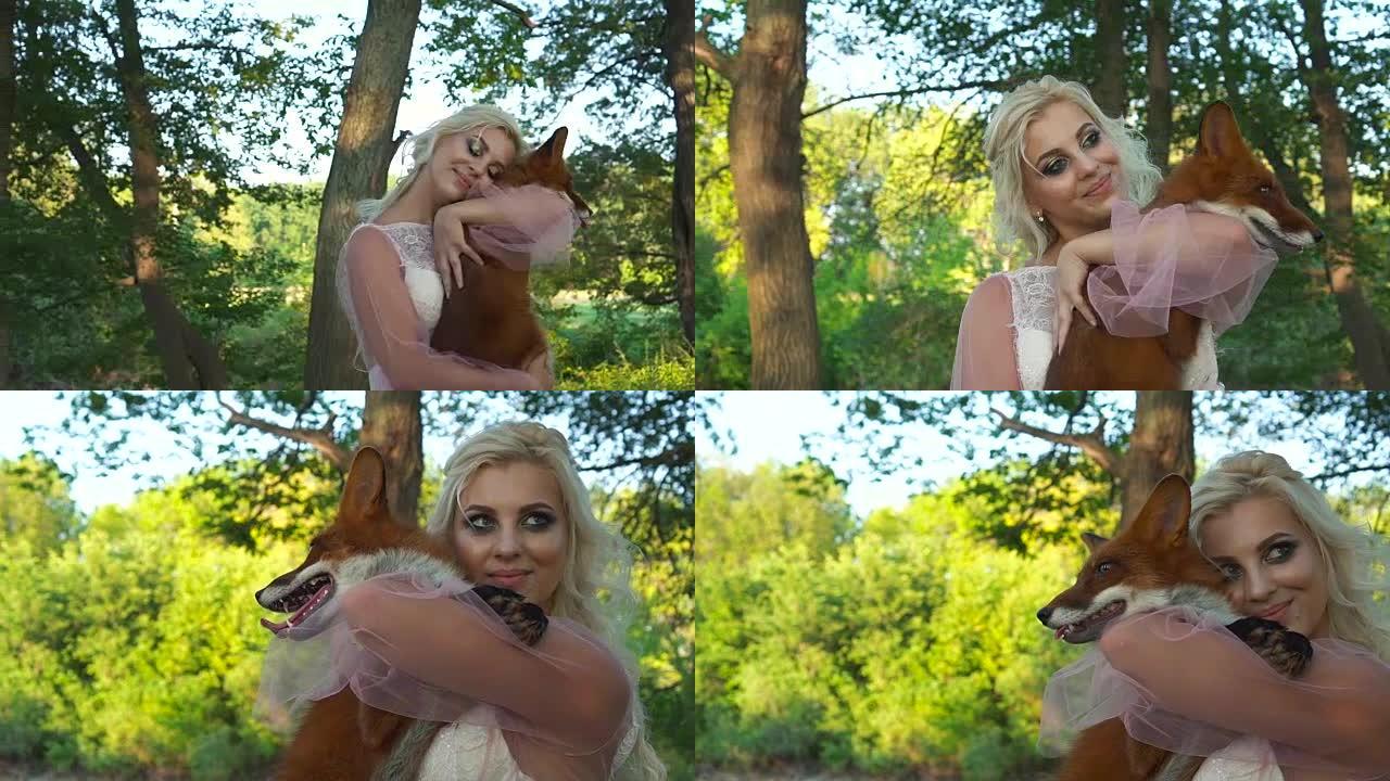 一个快乐的女人怀里抱着一只红狐狸。大自然中有狐狸的女人