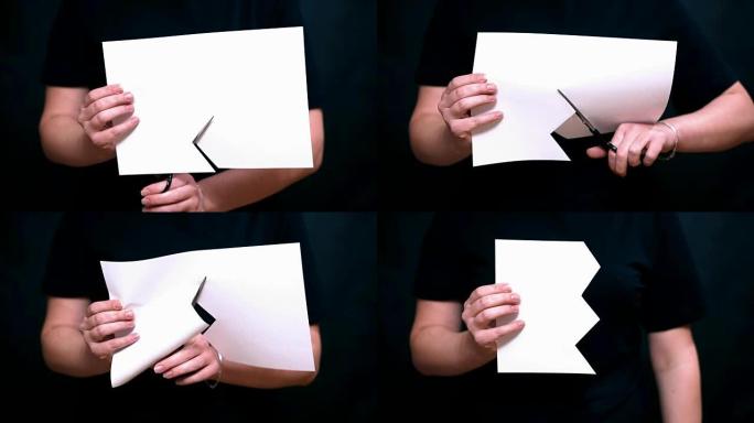 用一张纸双手合十。剪刀一张白纸之字形。