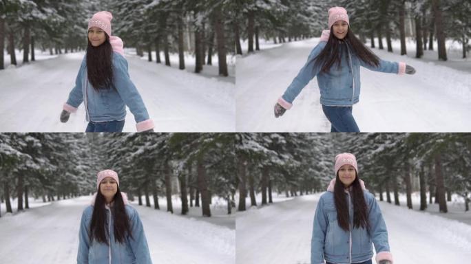 一个女孩在冬季森林中穿行，身体健康，四处旋转。
