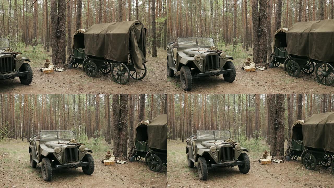 俄罗斯苏联第二次世界大战四轮驱动军用卡车Gaz-67汽车和森林中的农民车。红军第二次世界大战装备