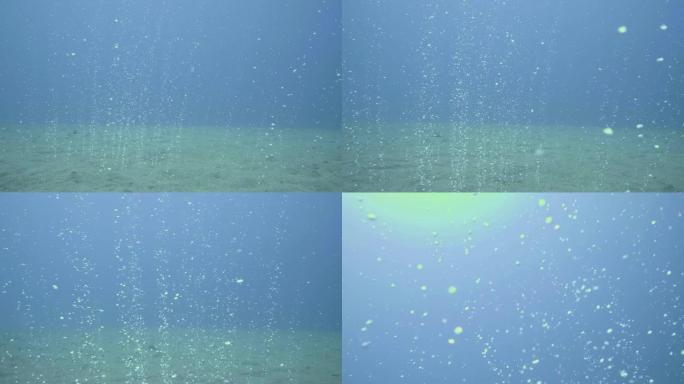 来自沙质海底的气泡上升到水面视点游泳潜水