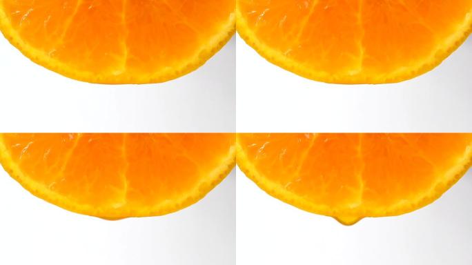 白色背景上的柑橘汁滴