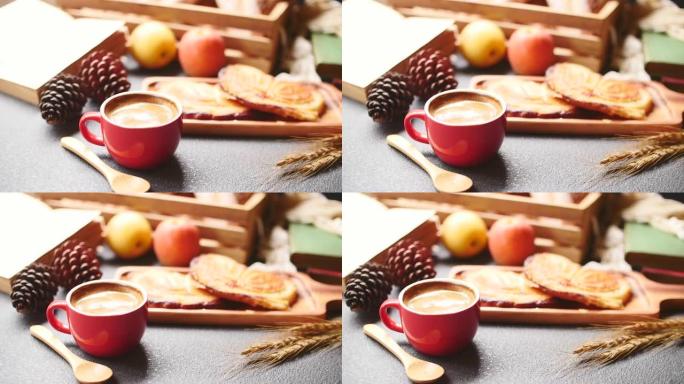 早餐场景，桌上有咖啡杯、面包和水果