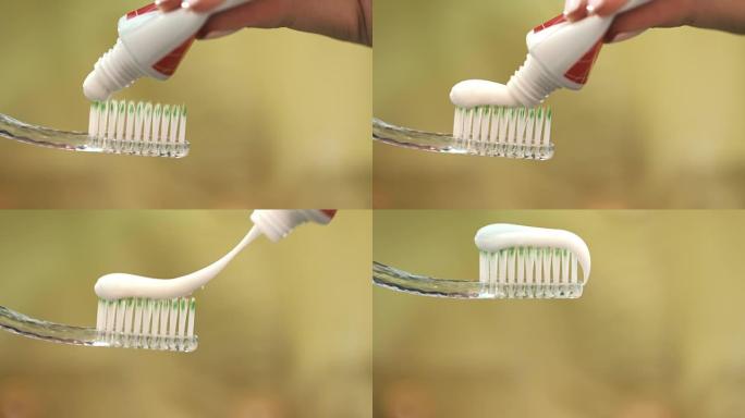 白色牙膏挤在牙刷上。女人手持牙刷