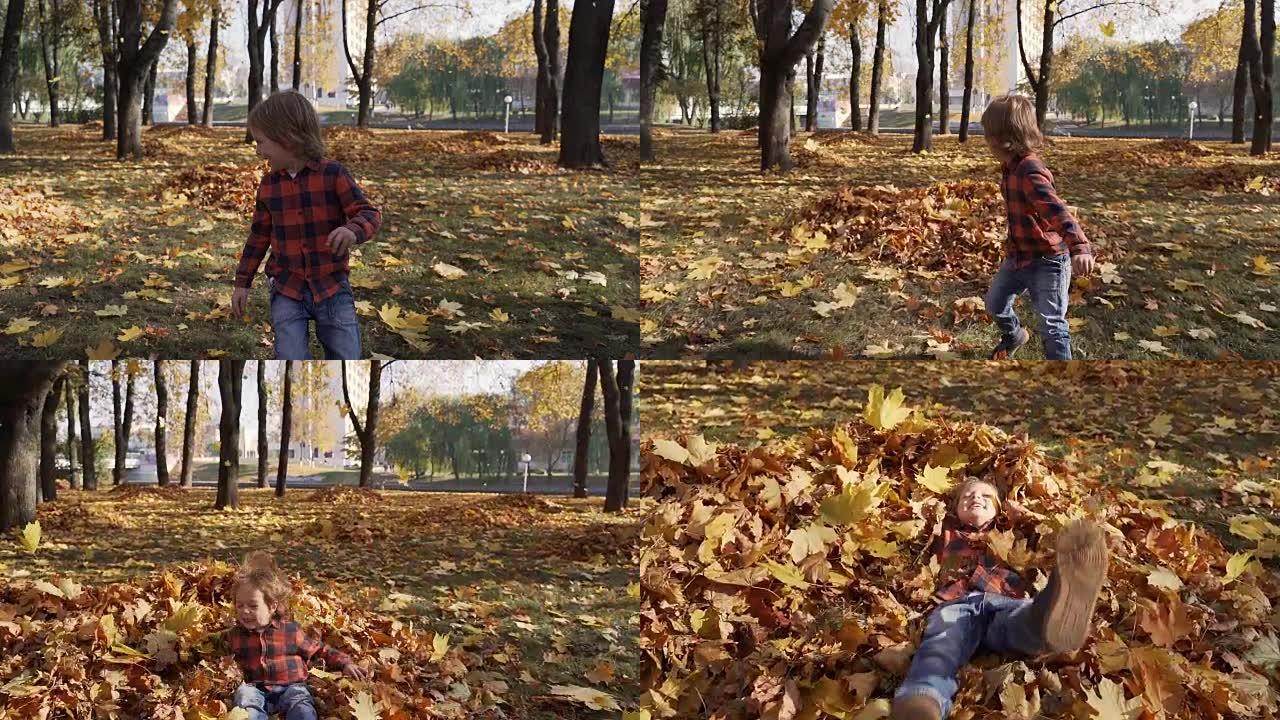 小男孩在秋天落叶中奔跑