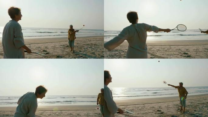 活跃的高级夫妇在海滩玩太极气球。