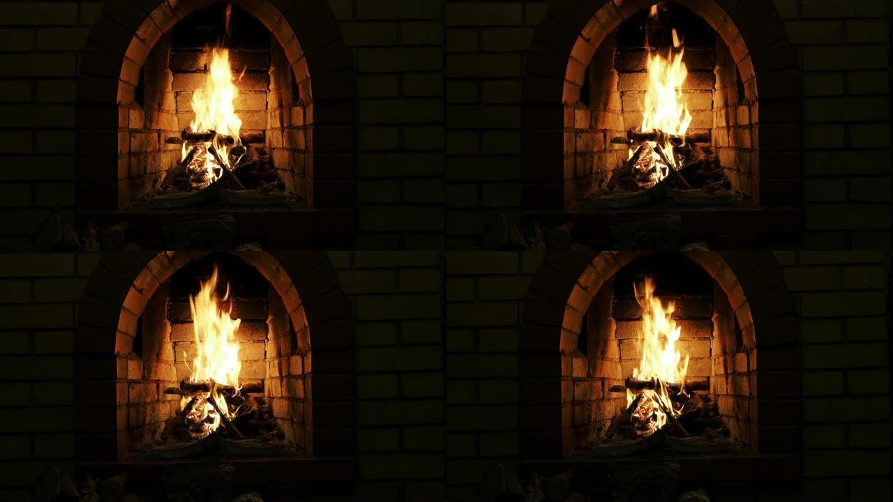 夜间燃烧木柴的壁炉的前视图