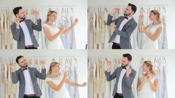 美丽的肖像模特婚礼情侣在工作室商店非常快乐的站立舞蹈