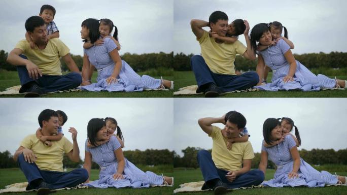 可爱的亚洲家庭，兄弟姐妹在公园放松