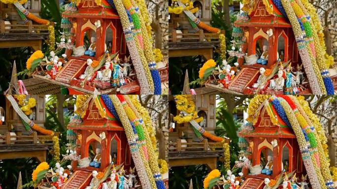 木制微型守护者精神屋。小佛寺神龛，五颜六色的花环。圣帕·普姆 (San phra phum) 树立了
