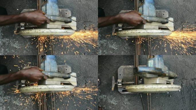 金属工人用电锯切割熨斗