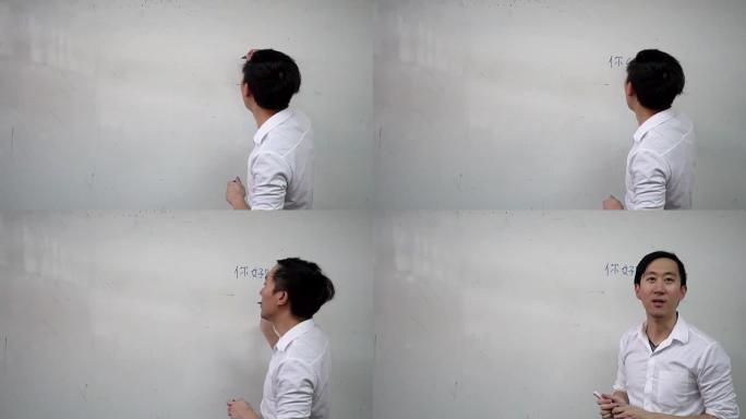 年轻的亚洲外国东方语言讲师在课堂上上语言课-日语，韩语，中文等亚洲语言教育概念-黑板上的字符是中文，