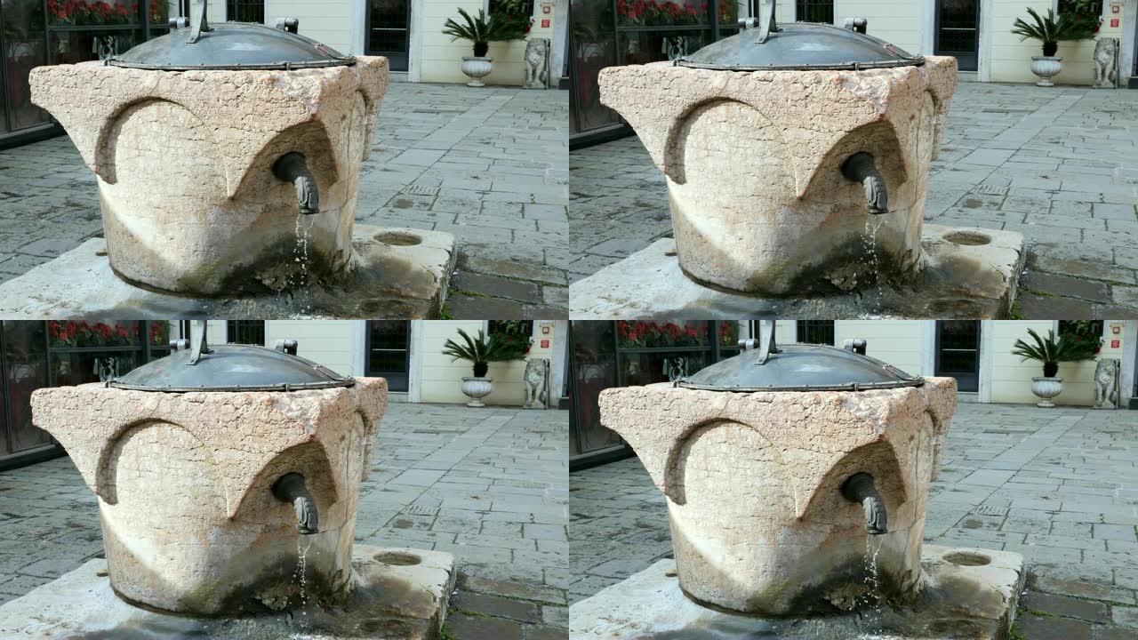 威尼斯古老的传统水井与倒水