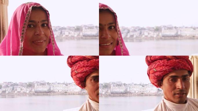 潘从穿着粉红色纱丽的美丽印度女士到拉贾斯坦邦普什卡的红色头巾绅士