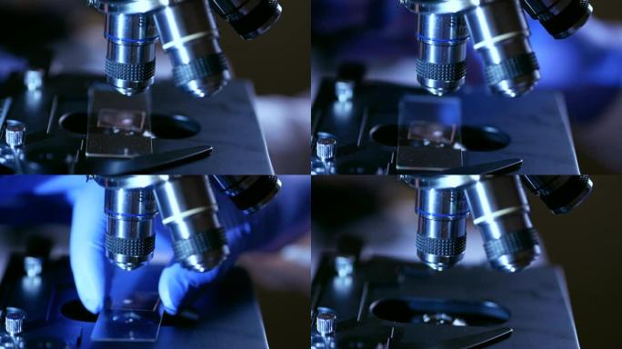 科学家手拿显微镜在实验室里拍特写。医学实验室的研究工具就在手上。关闭了。法医检查。4 k UHD。