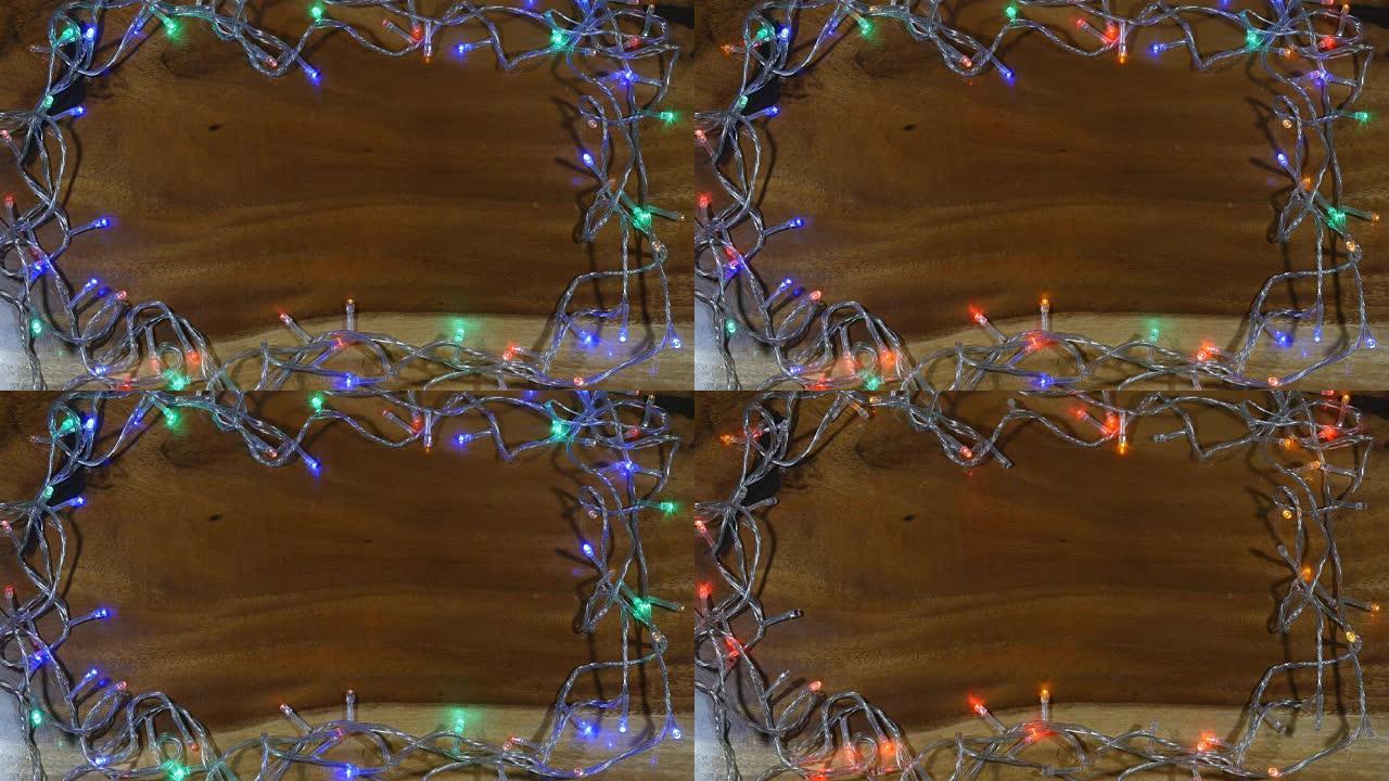 木制背景上的圣诞灯框