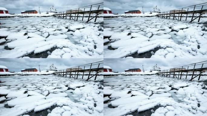 海面变成冰，雪开裂漂浮在海岸线上