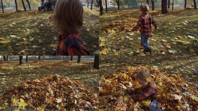 小男孩在秋天落叶中奔跑